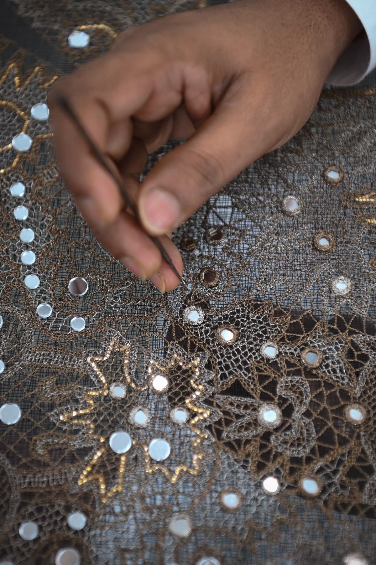Artisan hands teaching the next generation